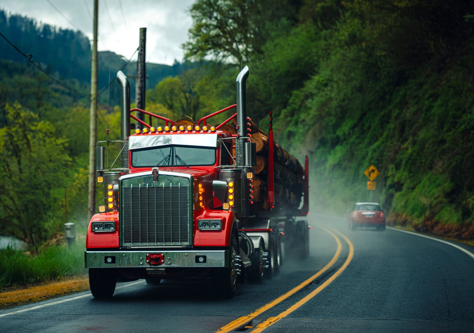 Semi-trailer on a misty highway at dawn